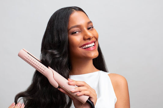 a woman holding a hair dryer in her hand