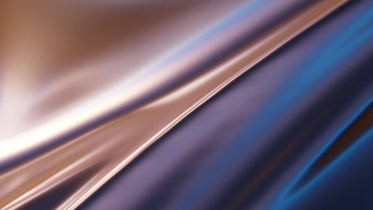 Silky, flowing fabric with reflective metallic colors.