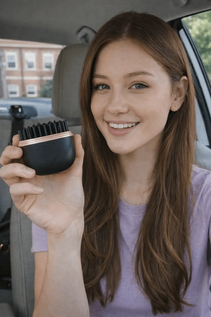 Woman holding a black hairbrush inside a car - silkflow